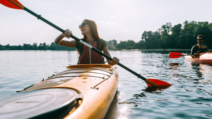 2 happy people in canoes